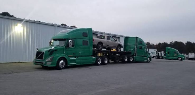 Green tractor carrying pickup