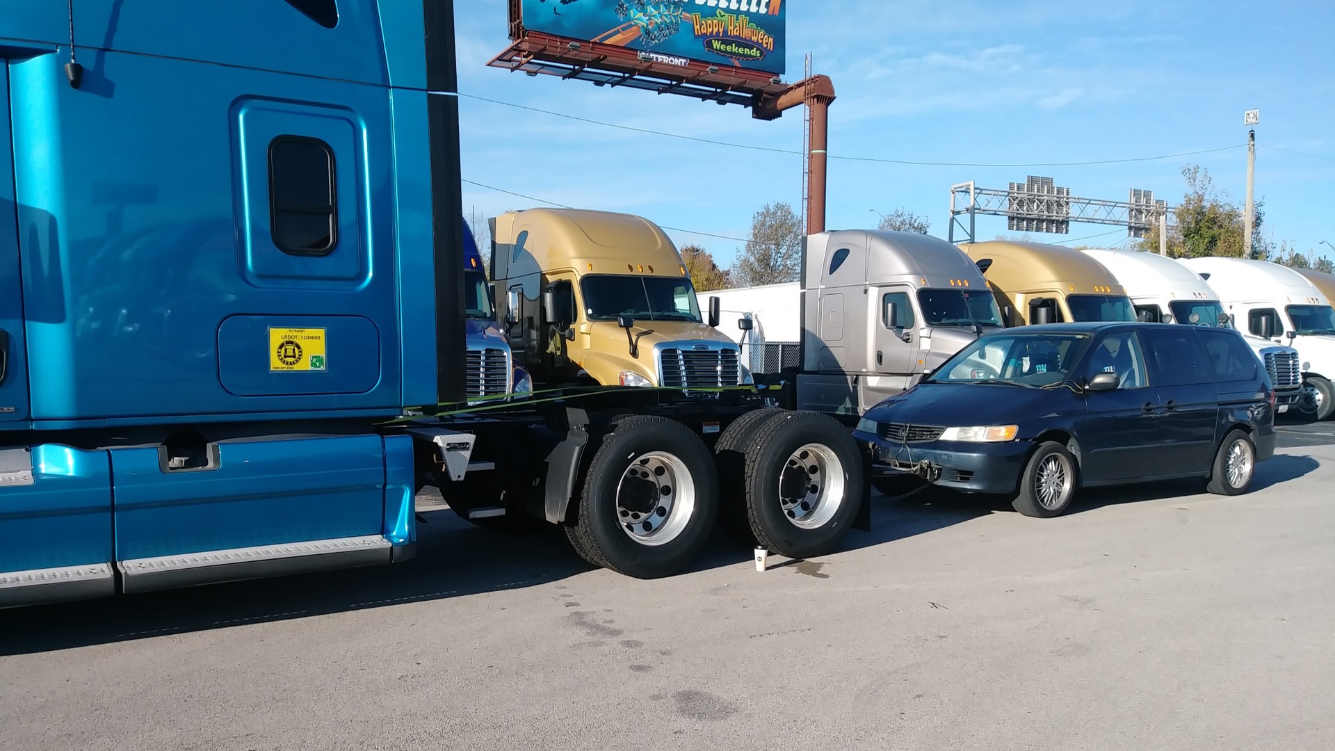 Blue tractor with chase vehicle